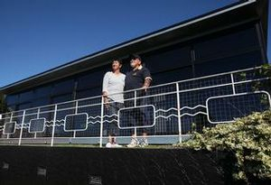 Tom and Mary Gear bask in the sun on the deck of their earthquake-proof steel home. Joel Ford.